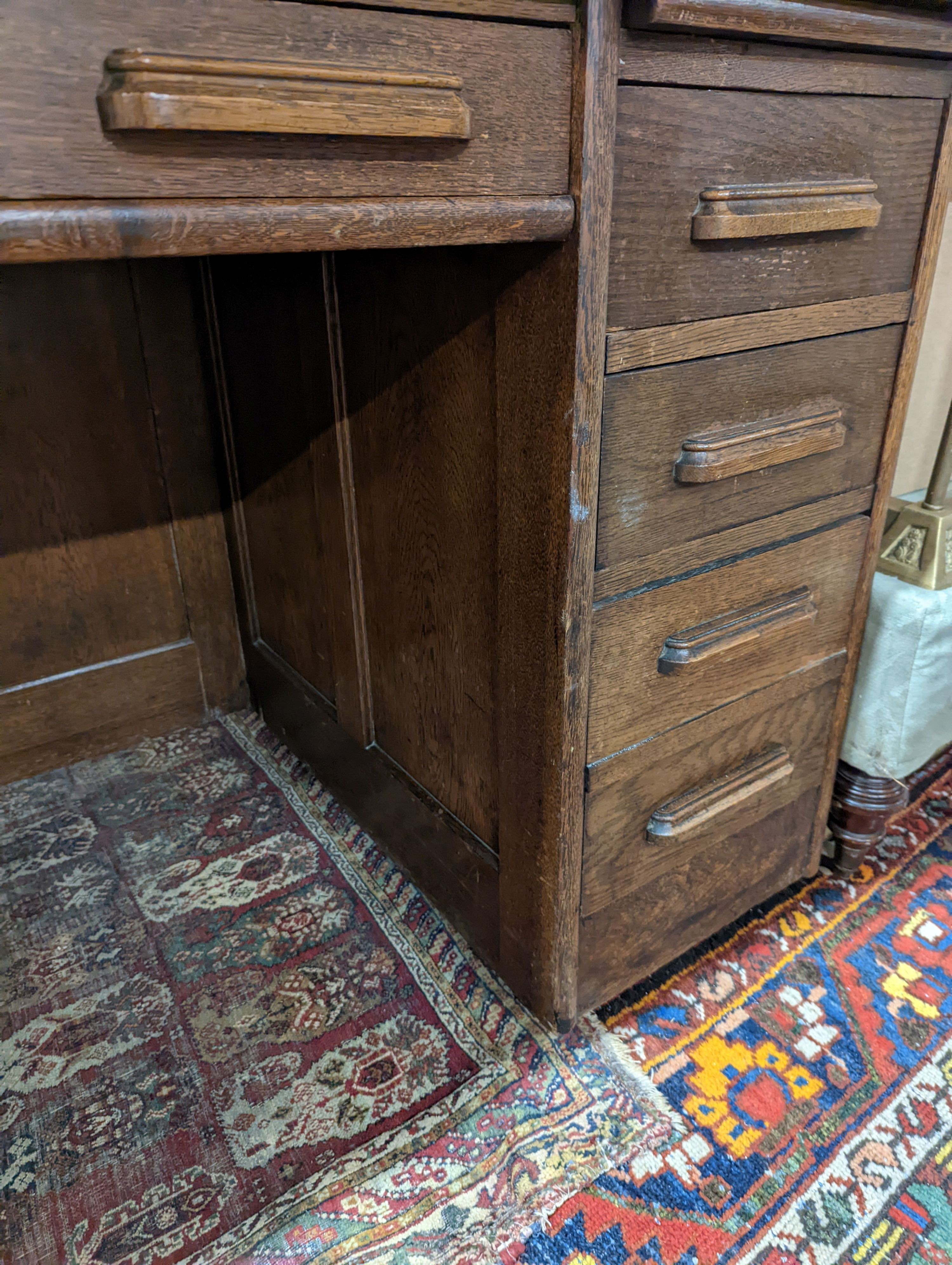 An early 20th century oak roll top desk with 'S' shaped tambour, width 106cm, depth 75cm, height 119cm